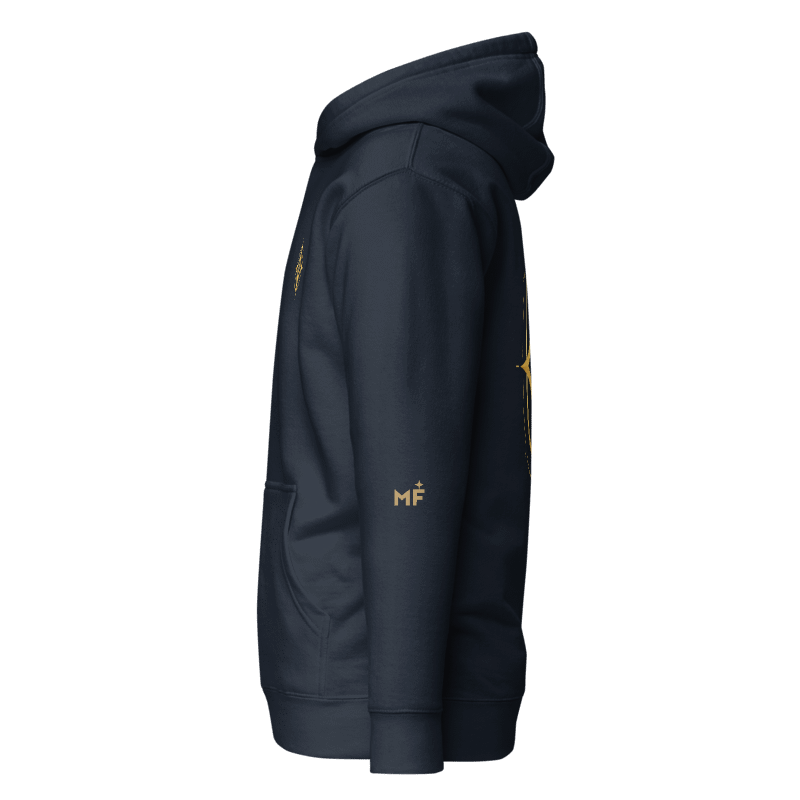 Digital design mockup of Celestial Compass navy hoodie left sleeve with a small gold-color MF monogram and star. Not a manufactured sample.