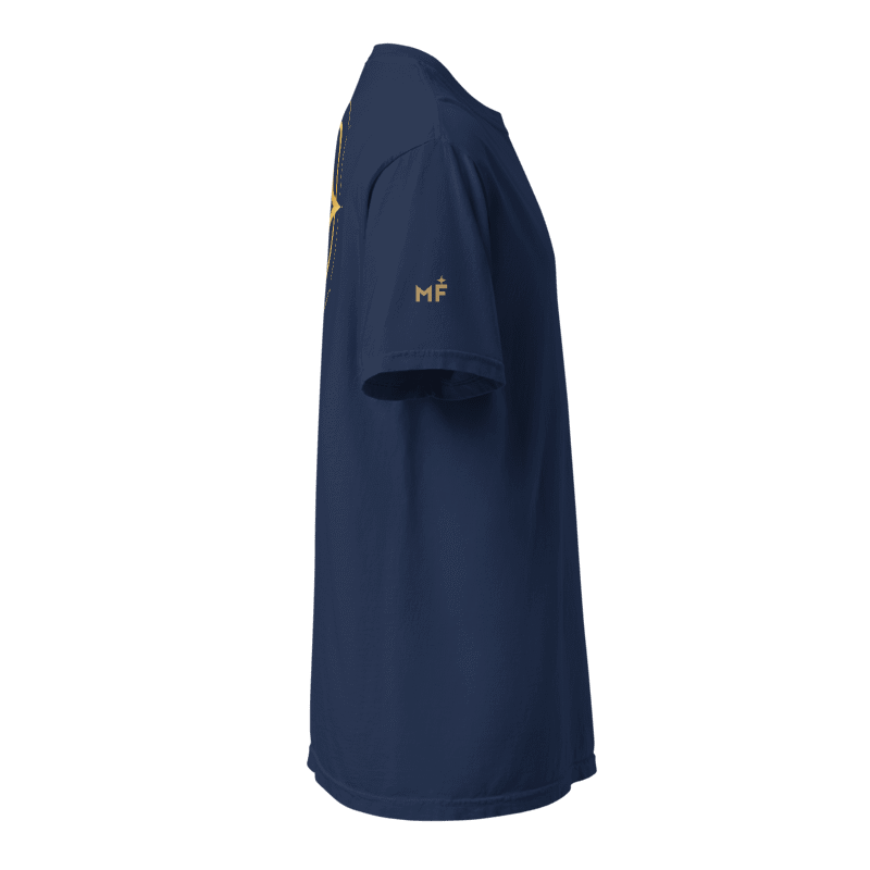 Digital design mockup of Compass-Eye True Navy T-shirt right sleeve with a small gold-color MF monogram and star. Not a manufactured sample.