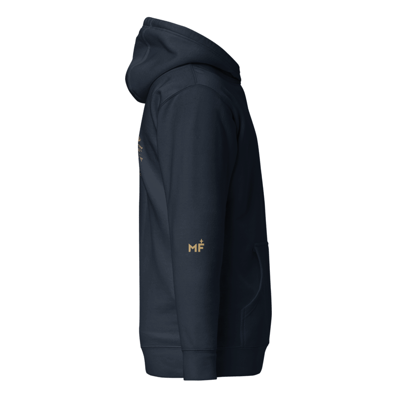 Digital design mockup of Mare navy hoodie right sleeve with small muted-gold MF monogram and star above the cuff. Not a manufactured sample.