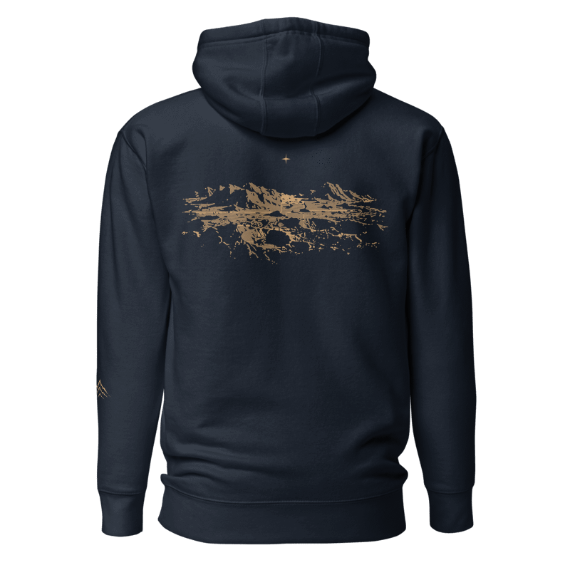 Printful mockup of Mare navy hoodie back with muted-gold lunar landscape and one star.