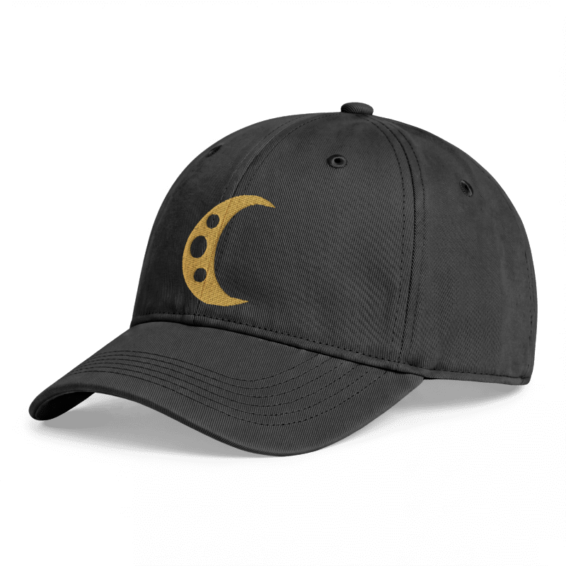 Digital angled mockup of the Umbra Hat on a black washed cotton cap, showing the gold crescent, three crater openings and curved bill.